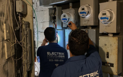 Master electricians investigating commercial property electrical meters.
